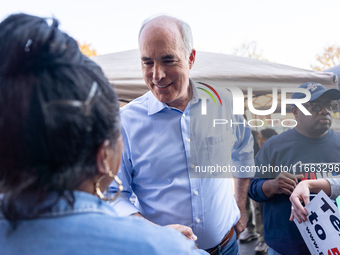 Sen. Bob Casey (D-PA) speaks to a woman outside a campaign rally in Philadelphia, Pennsylvania, United States, on October 13, 2024. (