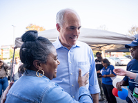 Sen. Bob Casey (D-PA) speaks to a woman outside a campaign rally in Philadelphia, Pennsylvania, United States, on October 13, 2024. (