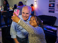 Sen. Bob Casey (D-PA) poses for a selfie with a child at a campaign rally in Philadelphia, Pennsylvania, United States, on October 13, 2024....