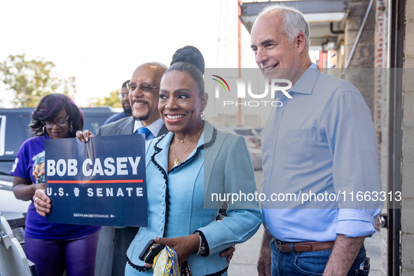 From left to right, State Sen. Vincent Hughes (D-Phila), actress and singer Sheryl Lee Ralph, and U.S. Sen. Bob Casey (D-PA) pose for a grou...