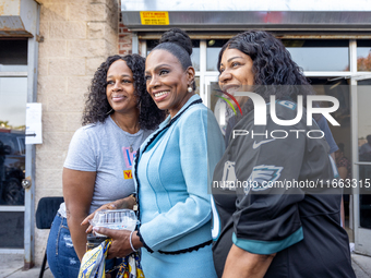 Actress and singer Sheryl Lee Ralph poses for a group picture with Harris-Walz supporters at a campaign event in Philadelphia, Pennsylvania,...