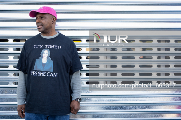 Harris-Walz campaign volunteer Martin Jones poses for a photo outside a campaign event in Philadelphia, Pennsylvania, United States, on Octo...