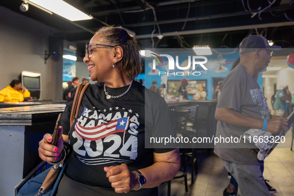 A woman dances at a campaign event in Philadelphia, Pennsylvania, United States, on October 13, 2024. 