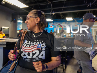 A woman dances at a campaign event in Philadelphia, Pennsylvania, United States, on October 13, 2024. (