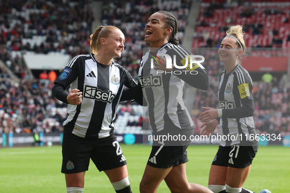 Beth Lumsden of Newcastle celebrates with Shania Hayles and Jasmine McQuade after scoring their first goal during the FA Women's Championshi...