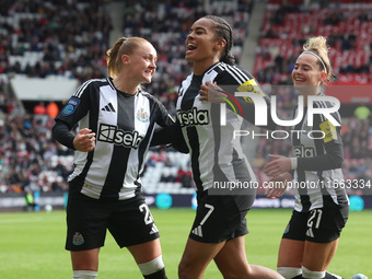 Beth Lumsden of Newcastle celebrates with Shania Hayles and Jasmine McQuade after scoring their first goal during the FA Women's Championshi...