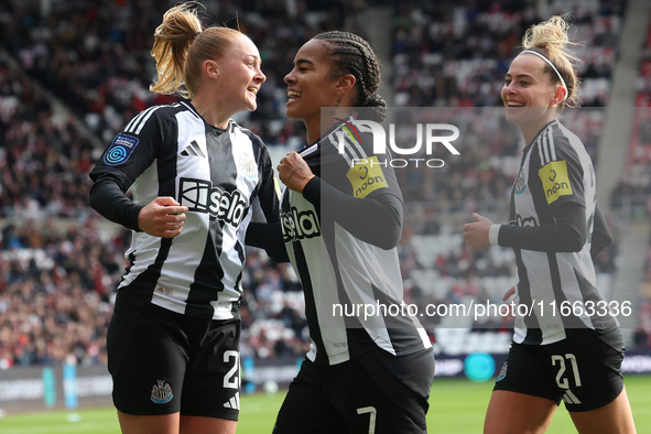 Beth Lumsden of Newcastle celebrates with Shania Hayles and Jasmine McQuade after scoring their first goal during the FA Women's Championshi...