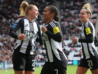 Beth Lumsden of Newcastle celebrates with Shania Hayles and Jasmine McQuade after scoring their first goal during the FA Women's Championshi...