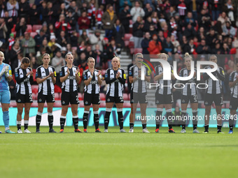 Newcastle's team joins in the applause for former club photographer Colin Lock, who passed away recently, during the FA Women's Championship...