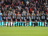 Newcastle's team joins in the applause for former club photographer Colin Lock, who passed away recently, during the FA Women's Championship...