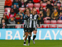 Beth Lumsden of Newcastle celebrates with her teammates after scoring their second goal during the FA Women's Championship match between Sun...