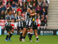 Beth Lumsden of Newcastle celebrates with her teammates after scoring their second goal during the FA Women's Championship match between Sun...