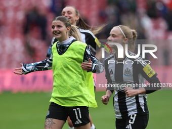 Newcastle's Kacie Elson and Katie Barker celebrate with their fans after their 2-1 win in the FA Women's Championship match between Sunderla...