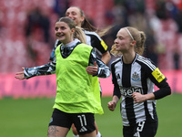 Newcastle's Kacie Elson and Katie Barker celebrate with their fans after their 2-1 win in the FA Women's Championship match between Sunderla...