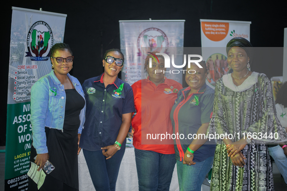 Social workers stand at their exhibition stand during the World Mental Health Day Awakening Summit, organized to discuss ''Mental Health at...