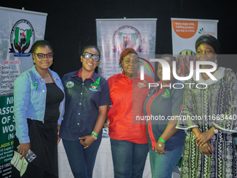 Social workers stand at their exhibition stand during the World Mental Health Day Awakening Summit, organized to discuss ''Mental Health at...