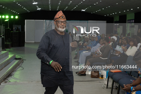 Toye Arologun, former Commissioner for Information, Oyo State and Founder of Suicide Is Not Solution (SINS), leaves the stage after his pres...