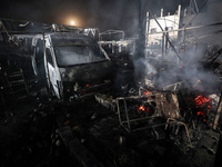 Rescuers work at the site of an Israeli strike on tents sheltering displaced people amid the Israel-Hamas conflict in Deir Al-Balah, Gaza St...