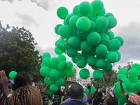 Ceremonial green balloons, symbolizing hope and resilience in the face of mental health challenges, are released during the launch of the ne...