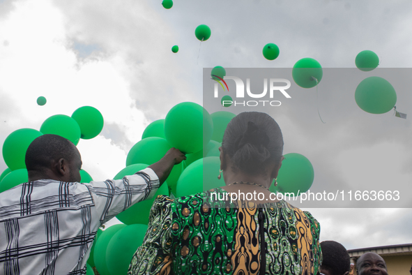 Ceremonial green balloons, symbolizing hope and resilience in the face of mental health challenges, are released during the launch of the ne...