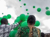 Ceremonial green balloons, symbolizing hope and resilience in the face of mental health challenges, are released during the launch of the ne...