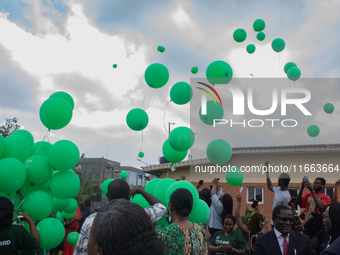 Ceremonial green balloons, symbolizing hope and resilience in the face of mental health challenges, are released during the launch of the ne...