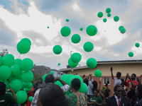 Ceremonial green balloons, symbolizing hope and resilience in the face of mental health challenges, are released during the launch of the ne...