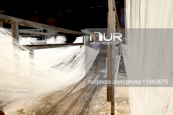 Villagers dry their noodles on wooden tanning racks in front and back of their farmhouses in Fuzhou, China, on October 13, 2024. 