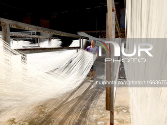 Villagers dry their noodles on wooden tanning racks in front and back of their farmhouses in Fuzhou, China, on October 13, 2024. (