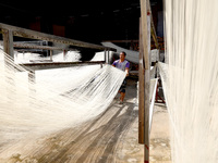 Villagers dry their noodles on wooden tanning racks in front and back of their farmhouses in Fuzhou, China, on October 13, 2024. (