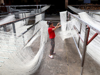 Villagers dry their noodles on wooden tanning racks in front and back of their farmhouses in Fuzhou, China, on October 13, 2024. (