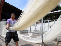 Villagers dry their noodles on wooden tanning racks in front and back of their farmhouses in Fuzhou, China, on October 13, 2024. (