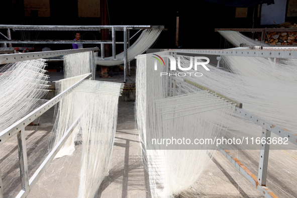 Villagers dry their noodles on wooden tanning racks in front and back of their farmhouses in Fuzhou, China, on October 13, 2024. 