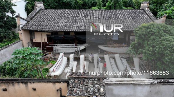 Villagers dry their noodles on wooden tanning racks in front and back of their farmhouses in Fuzhou, China, on October 13, 2024. 