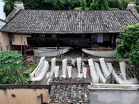 Villagers dry their noodles on wooden tanning racks in front and back of their farmhouses in Fuzhou, China, on October 13, 2024. (