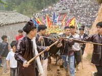 People watch a bullfight at a bullfighting pond in Congjiang County, Guizhou Province, China, on October 13, 2024. (