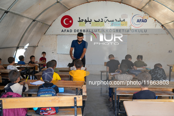 With The Approach Of Winter, Students In The Deir Ballut Camp In Rural Aleppo Study In A School Made Up Of Torn Tents, on october 13, 2024.