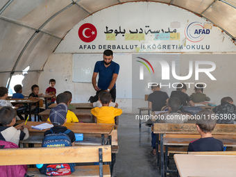 With The Approach Of Winter, Students In The Deir Ballut Camp In Rural Aleppo Study In A School Made Up Of Torn Tents, on october 13, 2024.(