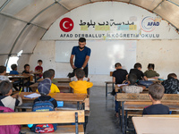 With The Approach Of Winter, Students In The Deir Ballut Camp In Rural Aleppo Study In A School Made Up Of Torn Tents, on october 13, 2024.(