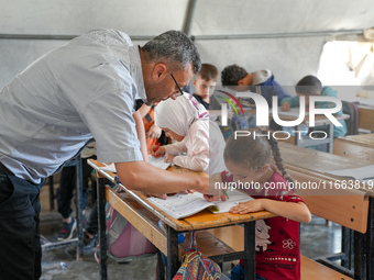 With The Approach Of Winter, Students In The Deir Ballut Camp In Rural Aleppo Study In A School Made Up Of Torn Tents, on october 13, 2024.(