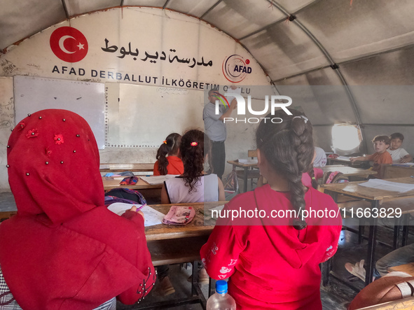 With The Approach Of Winter, Students In The Deir Ballut Camp In Rural Aleppo Study In A School Made Up Of Torn Tents, on october 13, 2024.