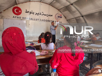 With The Approach Of Winter, Students In The Deir Ballut Camp In Rural Aleppo Study In A School Made Up Of Torn Tents, on october 13, 2024.(