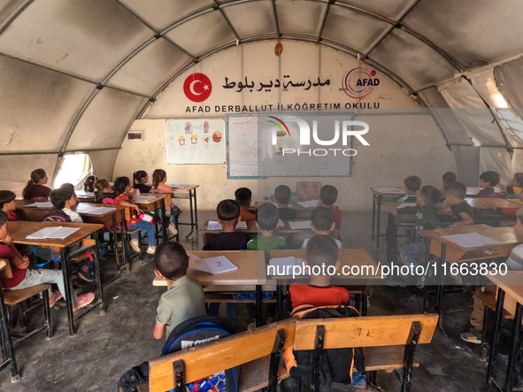 With The Approach Of Winter, Students In The Deir Ballut Camp In Rural Aleppo Study In A School Made Up Of Torn Tents, on october 13, 2024.