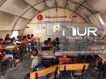 With The Approach Of Winter, Students In The Deir Ballut Camp In Rural Aleppo Study In A School Made Up Of Torn Tents, on october 13, 2024.(