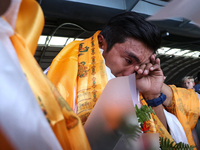 Nepalese youngest record holder climber Nima Rinji Sherpa cries after arriving at Tribhuvan International Airport in Kathmandu, Nepal, on Oc...