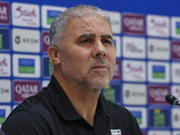 Palestine national team head coach Makram Daboub attends a press conference at Jassim Bin Hamad Stadium in Doha, Qatar, on October 14, 2024,...