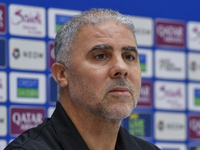 Palestine national team head coach Makram Daboub attends a press conference at Jassim Bin Hamad Stadium in Doha, Qatar, on October 14, 2024,...