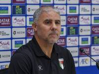 Palestine national team head coach Makram Daboub attends a press conference at Jassim Bin Hamad Stadium in Doha, Qatar, on October 14, 2024,...