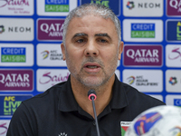 Palestine national team head coach Makram Daboub attends a press conference at Jassim Bin Hamad Stadium in Doha, Qatar, on October 14, 2024,...