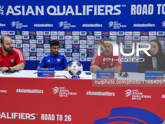 Kuwait team head coach Juan Pizzi (2nd R) and player Redha Abujabarah (2nd L) attend a press conference at Jassim Bin Hamad Stadium in Doha,...